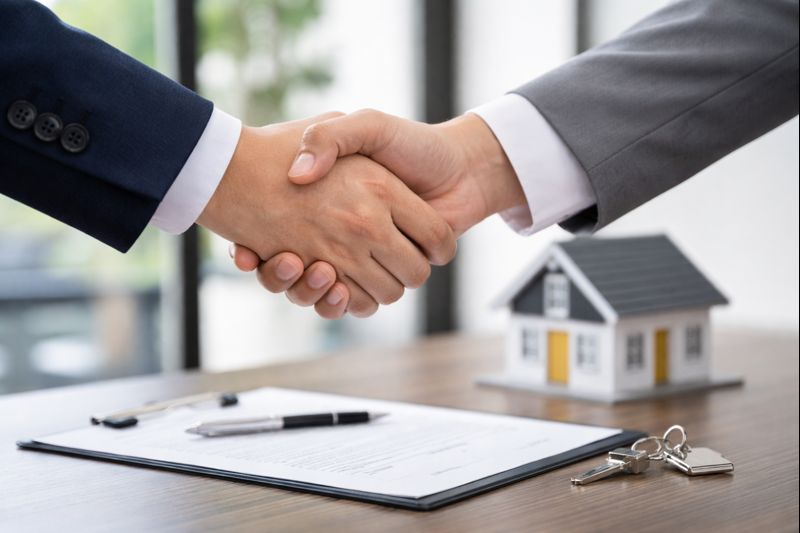 Realtor and buyer shaking hands